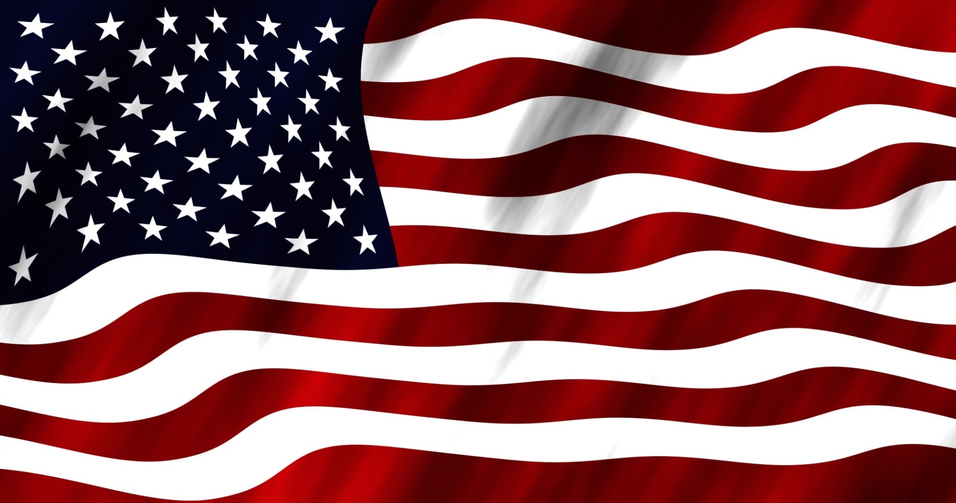 Waving American flag with white stars on dark blue and red-and-white stripes across the frame.